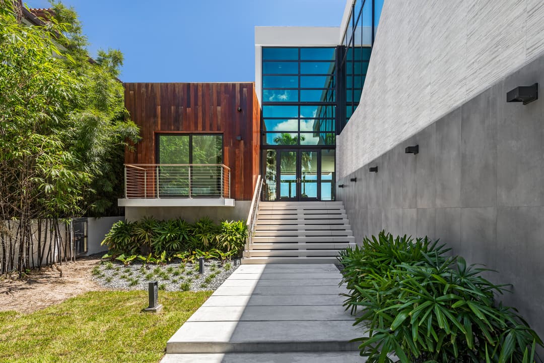 modern home with massive glass windows